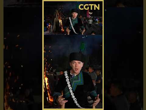 CGTN correspondent Ken Browne joins the Yi people's bonfire dance in traditional Yi attire