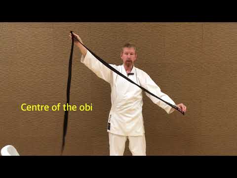 Putting on karate-gi & obi