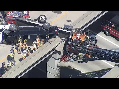 LIVE: Truck hanging off overpass at U.S. 75 & Hwy 121