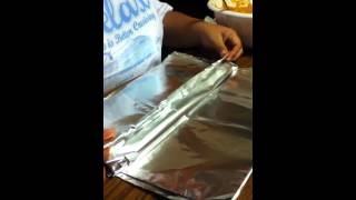 preview picture of video 'How to wrap Pastales in foil. Pasteles? I'm not sure.'
