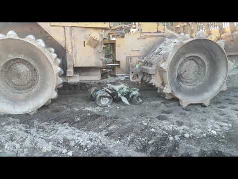 ATV GETTING CRUSHED BY DOZER