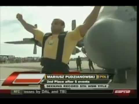 Mariusz Pudzianowski pulling an US Force Airplane.mp4