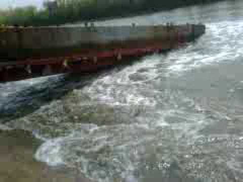 semi truck flatbed,launching a construction barge into the canal