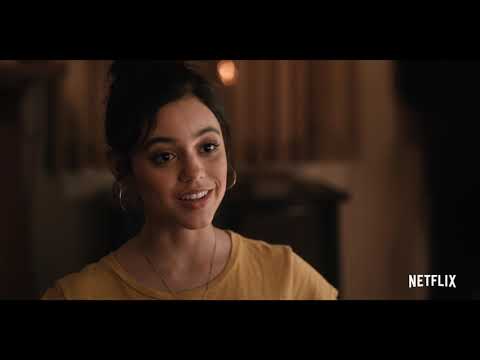 Trailer still: theme-park slow-motion walk with the Torres family