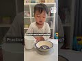 Toddler Spills Milk On The Floor While Trying To Pour It Into Bowl Of Cereal