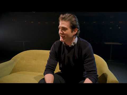 Trailer still of a filmed staging with four actors swapping characters in quick-sketch transitions