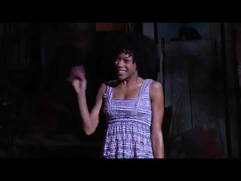 Trailer cutaway: ensemble kick line during a jubilant finale button