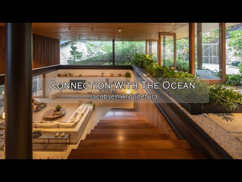 Exploring An Oceanfront House Design From Steel, Stone, and Wood Seamless Connection with The Sea