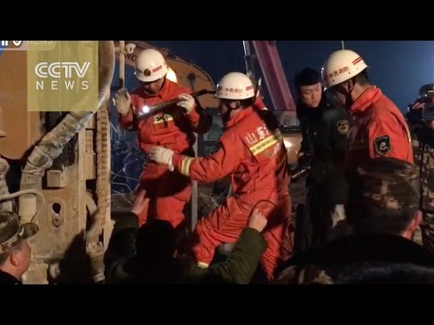 Rescuers dig tunnel to send food to trapped miners in Shandong