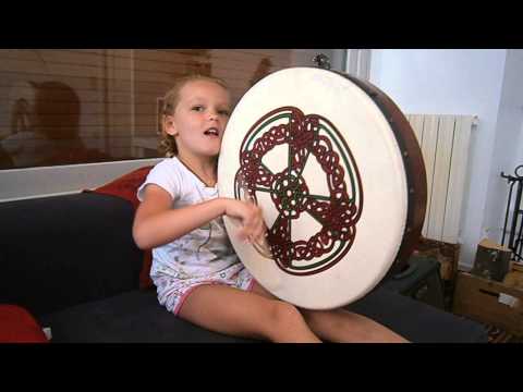 Meadow playing bodhran