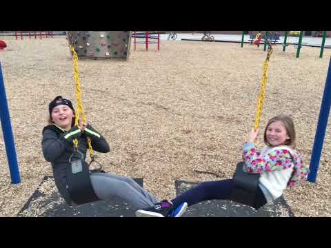 Girls swinging at park