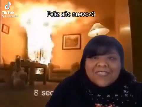 lady speaking spanish while a christmas tree catches on fire