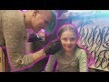 Little Girl Gets Her Ears Pierced At Tattoo Shop