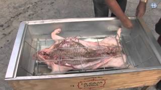 How to roast a whole pig in a Caja China