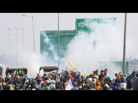 Indian police fire tear gas at farmers in a highway standoff | AFP