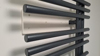 Hanging towel rail radiator on plasterboard..