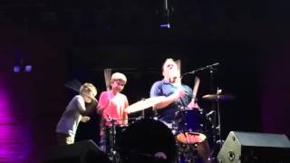 Kids drumming with Cowboy Mouth