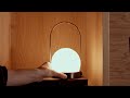 Audo Copenhagen Carrie Portable LED Table Lamp In Bronzed Brass With Luxurious Leather Detailing