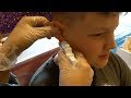 kids getting their ears pierced, brother and sister.