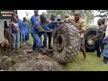 MAN 6x6 EXPEDITION TRUCK STUCK IN THE MUD IN AFRICA AND A PUNCTURE.