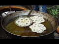 flower shaped jalebis being made at a market in guijan assam