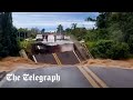 Brazil floods: Man narrowly avoids death after motorway bridge collapses