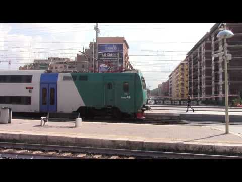 Trenitalia & Leonardo express trains meet at Roma Tuscolana station in Rome, Italy.