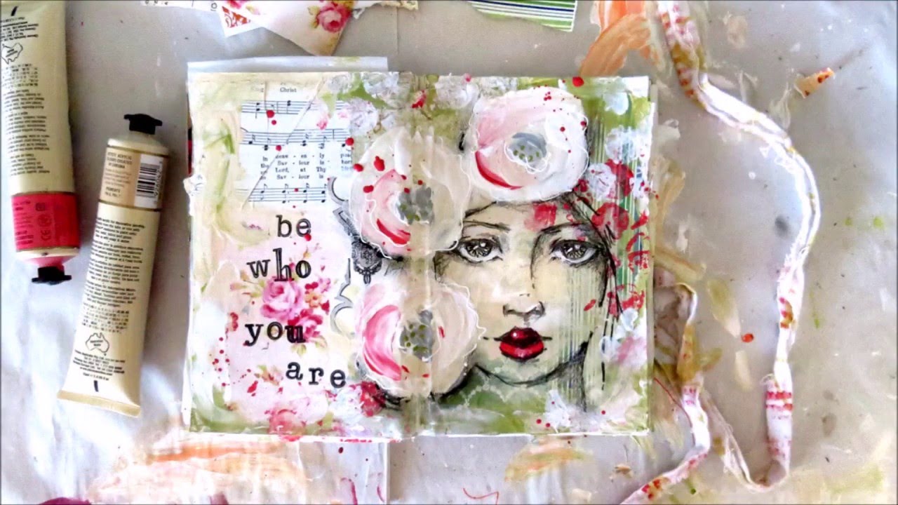 creating art journal page with mixed media and girls face