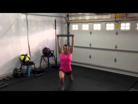 Overhead Plate Walking Lunges - H.I.T. Club Fitness