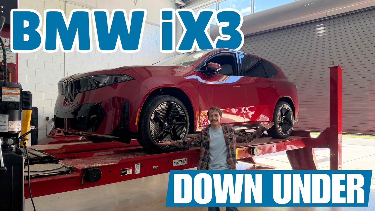BMW iX3 raised on a lift with its underbody panels removed