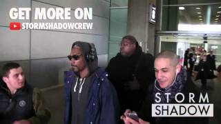 EXCLUSIVE: Newly grandad, Snoop Dogg arrives dancing at Paris airport