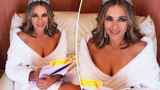 Elizabeth Hurley 52 flashes major cleavage as she appears NAKED under white robe
