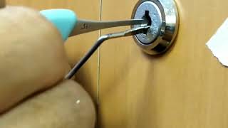 Unlocking cabinet cam lock