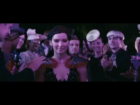 Catching Fire trailer still: Katniss looks up as the Quarter Quell looms
