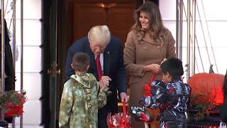 Trump and first lady welcome dinosaur, skeletons on Halloween eve