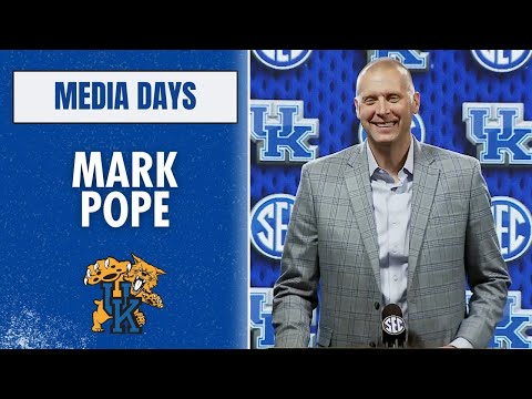 Mark Pope at the podium at SEC Media Days