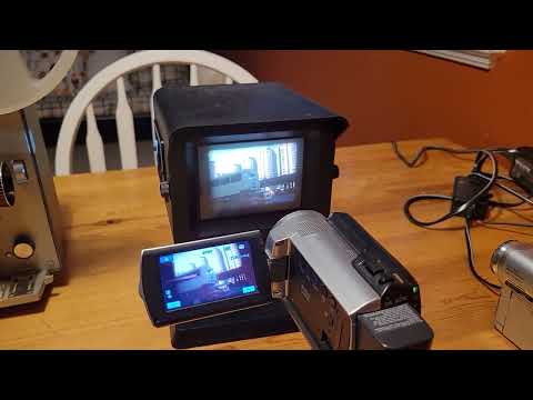Bell & Howell super 8 film projector with Video-Cine Converter and Sony Camcorder