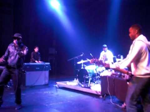 Talib Kweli + Band performing 
