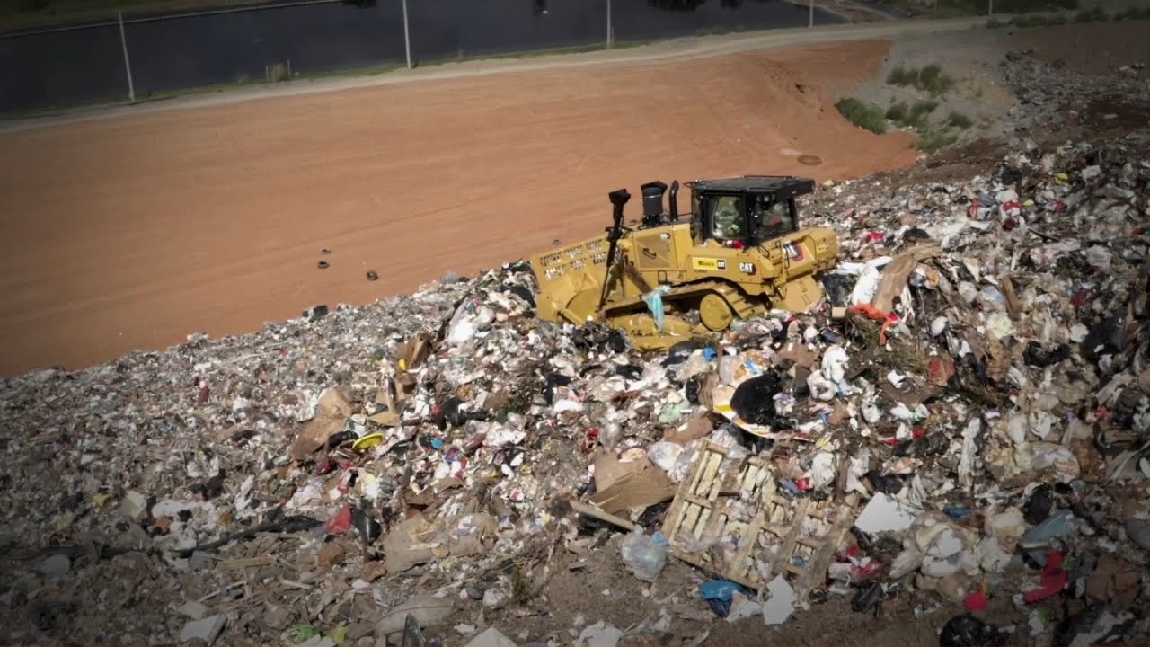 Cat D6 XE Waste Handling Dozer at Work in a Landfill