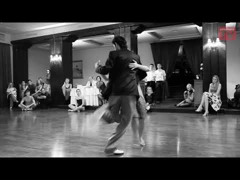  Adrian Ferreyra  and  Dana Frigoli  are  dancing  to  the  nontraditional song  "  Milonga Para Una Armonica  "  by  Hugo Díaz