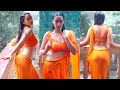 Megha Shukla Wet Posing In Rain With Orange Plain Saree Paired With Matching Orange Blouse