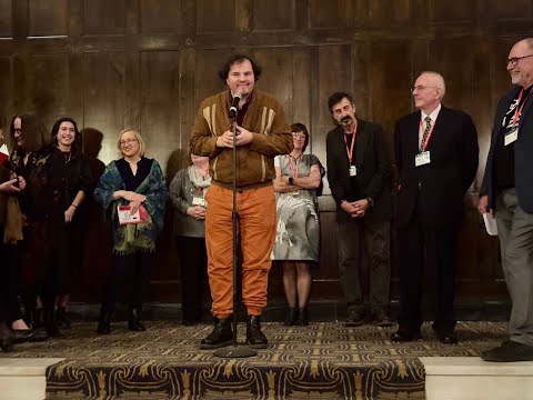 Bartosz Paduch accepts the Ewa Pięta Award for Best Documentary at the 32nd AAPFF.