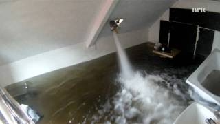 Collapsing floor by filling room with water