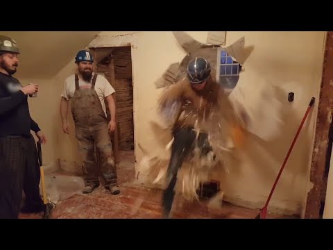 Construction Worker Breaks through Wall