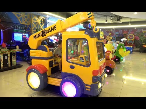 Little Boys Playing Indoor playground family fun at play center with many toys color