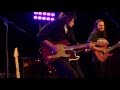 andy wood band covers make up and faded blue jeans.