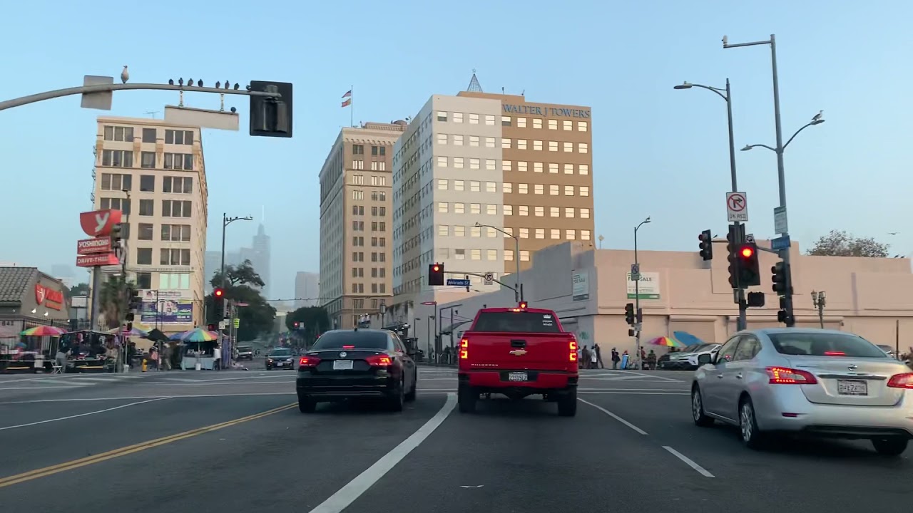 Driving down Wilshire Blvd. past shuttered MacArthur Park, Los Angeles