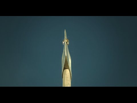 Axe Blade splitting Bullet in slow motion