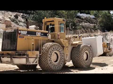 Caterpillar 988F Wheel Loader moves marble blocks