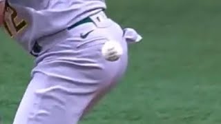 Ball hits baseball player in the ass